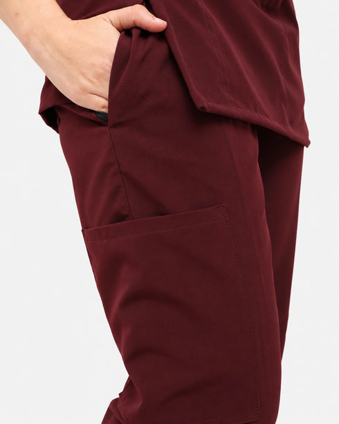 Close-up of the trouser pocket on women's maroon scrub pants