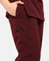 Close-up of the trouser pocket on women's maroon scrub pants