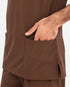 Close-up of a person wearing brown scrub clothing, with a hand inserted into a front pocket.